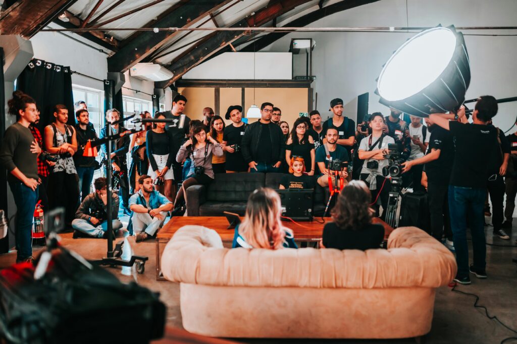 Behind-the-scenes of a photo shoot with a diverse team working together in a São Paulo studio.